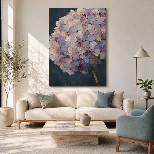 A large vertical canvas wall art print featuring an abstract purple and lavender hydrangea on a dark teal background, displayed in a modern living room setting above a cream sofa.