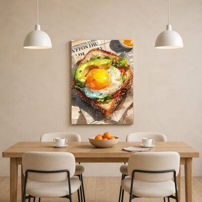 A framed wall art print showing a close-up of avocado toast with a sunny egg sits above a dining table with chairs, cups, and oranges in a bright, modern room.