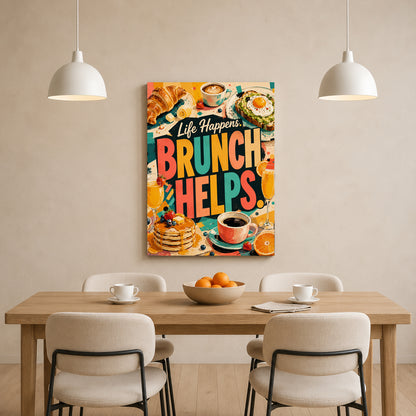 A colorful canvas wall art print featuring the text 'Life Happens BRUNCH HELPS.' with brunch food illustrations, displayed above a wooden dining table with chairs in a bright, modern dining room.