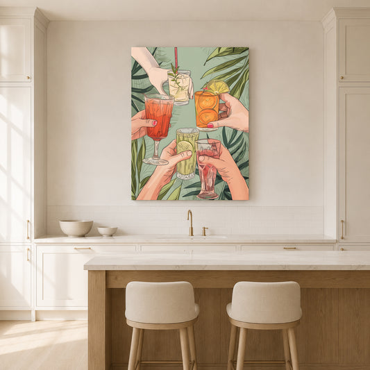 A vertical canvas wall art print depicting a group of hands holding up colorful cocktails in front of tropical green leaves, displayed on a light beige kitchen wall above a marble-top island with two stools.
