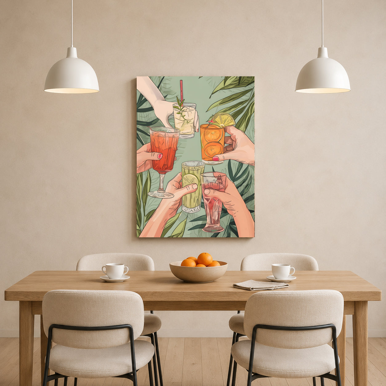 A vertical canvas wall art print depicting a group of hands toasting with colorful cocktails against a green tropical leaf background, displayed on a beige wall above a wooden dining table with four chairs and two hanging pendant lights.