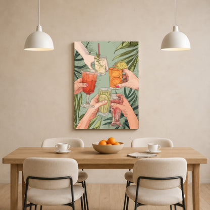 A vertical canvas wall art print depicting a group of hands toasting with colorful cocktails against a green tropical leaf background, displayed on a beige wall above a wooden dining table with four chairs and two hanging pendant lights.