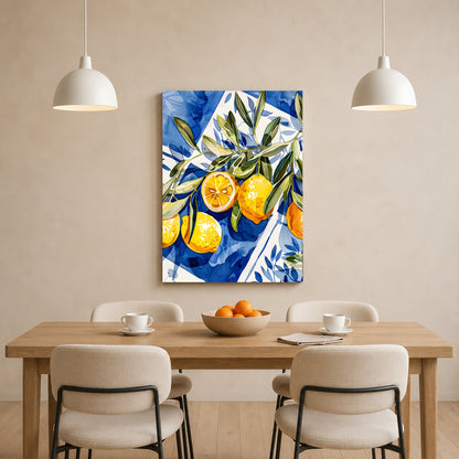 A vertical canvas wall art print featuring a vibrant blue and white patterned background with yellow oranges and green leaves, displayed above a wooden dining table with chairs in a modern dining room setting.