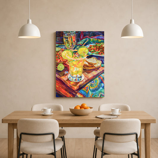 A colorful canvas wall art print depicting a vibrant still life of a margarita glass with lime slices, tortillas, and a drink, displayed on a beige wall above a wooden dining table with four chairs and two hanging pendant lights.