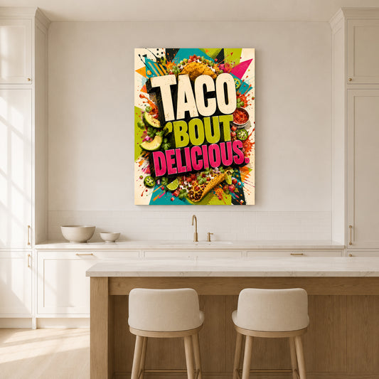 A colorful wall art canvas print featuring the text 'TACO BOUT DELICIOUS' surrounded by taco illustrations, displayed in a bright, modern kitchen above a counter with two stools.